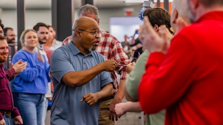 J.B. Hunt employees cheering on Patrick, the 2024 IC of the Year at his corporate celebration.